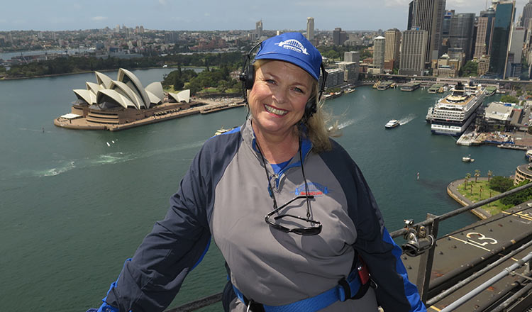 The Carousel Food Editor Lyndey Milan smiling at the top of Sydney Harbour Bridge