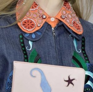 Model wears doubled embroidered collar