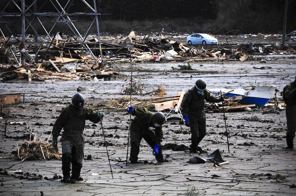 Survivors of Japan's Fukushima earthquake search through the mud, hoping they will find heirlooms, photos, family remains