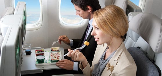 couple eating on an airplane