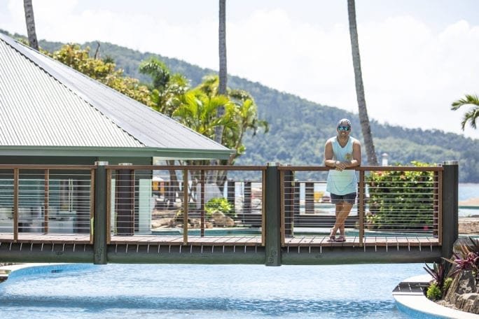 Lincoln Lewis relaxing by pool on Daydream Island