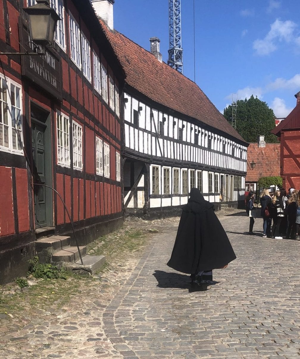 A citizen of Aarhus, Den Gamle Going About Their Day