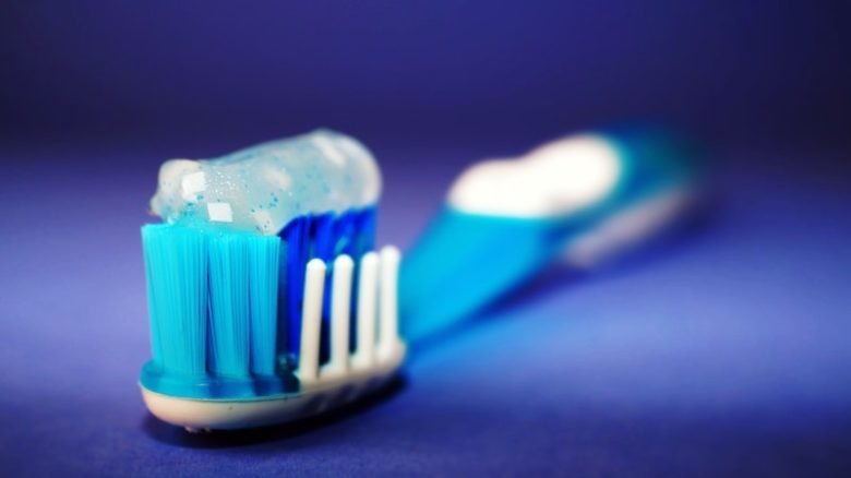 Toothpaste on a toothbrush, house products