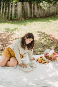 pregnant woman having picnic in yard