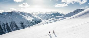 two man hiking on snow mountain