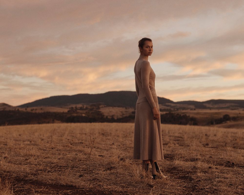 Woman wearing a Country Road wool-silk blend dress on a farm